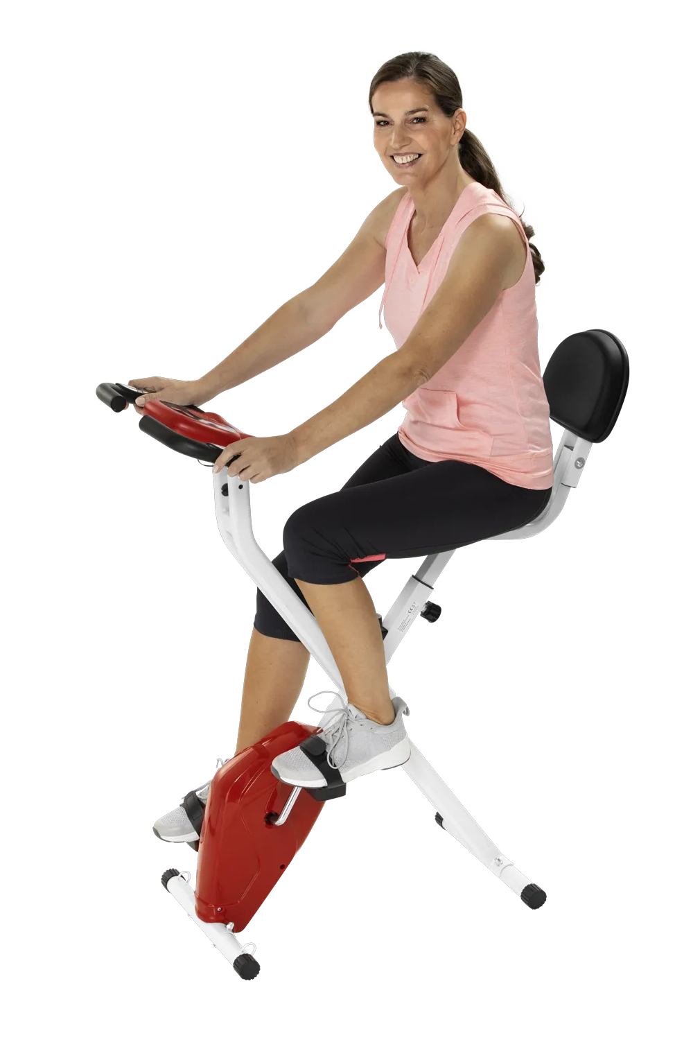 Frau trainiert auf heimtrainer-2in1, klappbarer Ergometer mit Arm- und Oberkörpertrainer für Zuhause