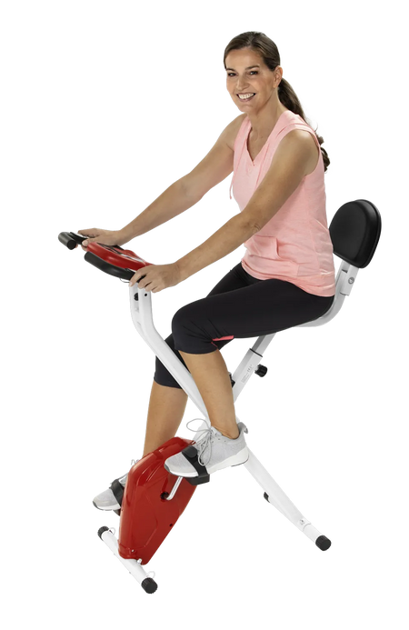 Frau trainiert auf heimtrainer-2in1, klappbarer Ergometer mit Arm- und Oberkörpertrainer für Zuhause