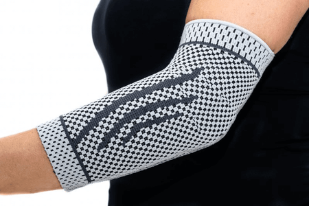 Ellenbogenbandage mit Silikonverstärkung am Arm, stabilisierend und entlastend bei Schmerzen, Reizung und Schwellung