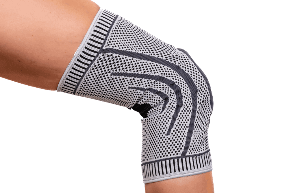 Knieorthese mit Spiralverstärkung am gebeugten Knie, Kompressionsbandage mit Patella-Stabilisierung für mehr Stabilität im Kniegelenk