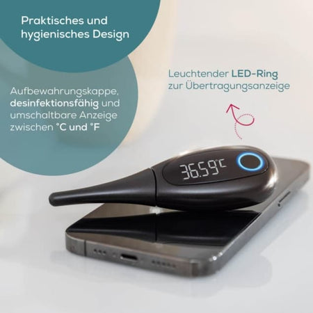 Basalthermometer OT 30 mit LED-Ring und Bluetooth-Übertragungsanzeige, zeigt 36,59 °C, liegt auf Smartphone für App-Zykluskontrolle